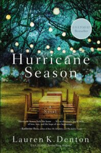 Cover art for Hurricane Season by Lauren K. Denton. Features and image of a yard with a long table and chair set with fairy lights in the trees.